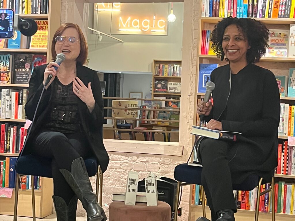 Maud Newton and Maaza Mengiste sit on stools with microphones in Books are Magic boosktore, discussing Ancestor Trouble. Photo by Andrea Walker.
